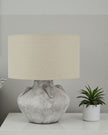 Athena handcrafted stone lamp by Lekanis Design, 32cm tall, showcasing a textured stone base and warm lighting for elegant decor.