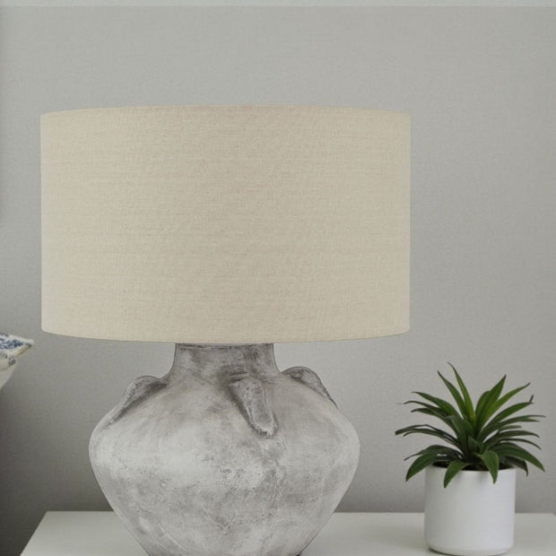 Athena handcrafted stone lamp by Lekanis Design, 32cm tall, showcasing a textured stone base and warm lighting for elegant decor.