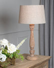 Delaney candlestick lamp by Hill Interiors, 70cm tall with natural wash wood finish and linen shade, ideal for living room lighting.