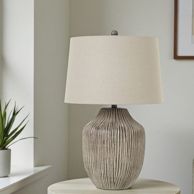 Ochre brown wooden lamp with warm linen shade, 71cm tall, modern lighting from Hill Interiors.
