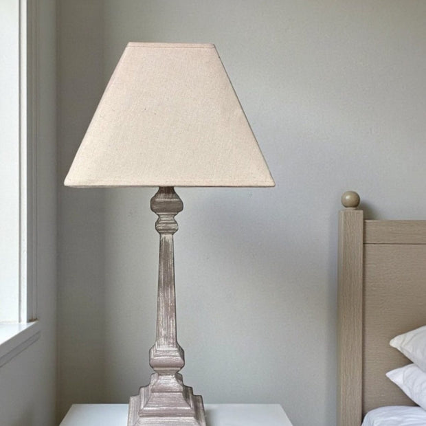 Wooden table lamp by Hill Interiors featuring a sleek design and warm lighting, measuring 51cm tall.