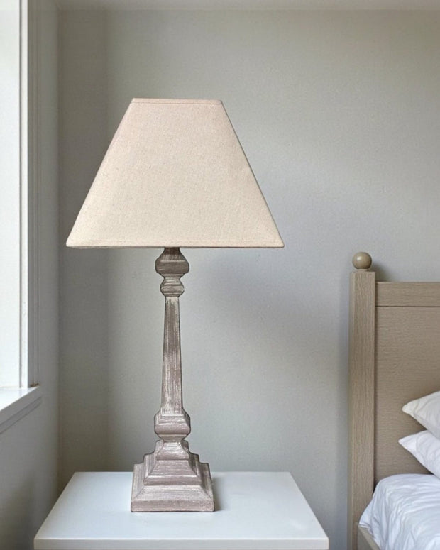 Wooden table lamp by Hill Interiors featuring a sleek design and warm lighting, measuring 51cm tall.