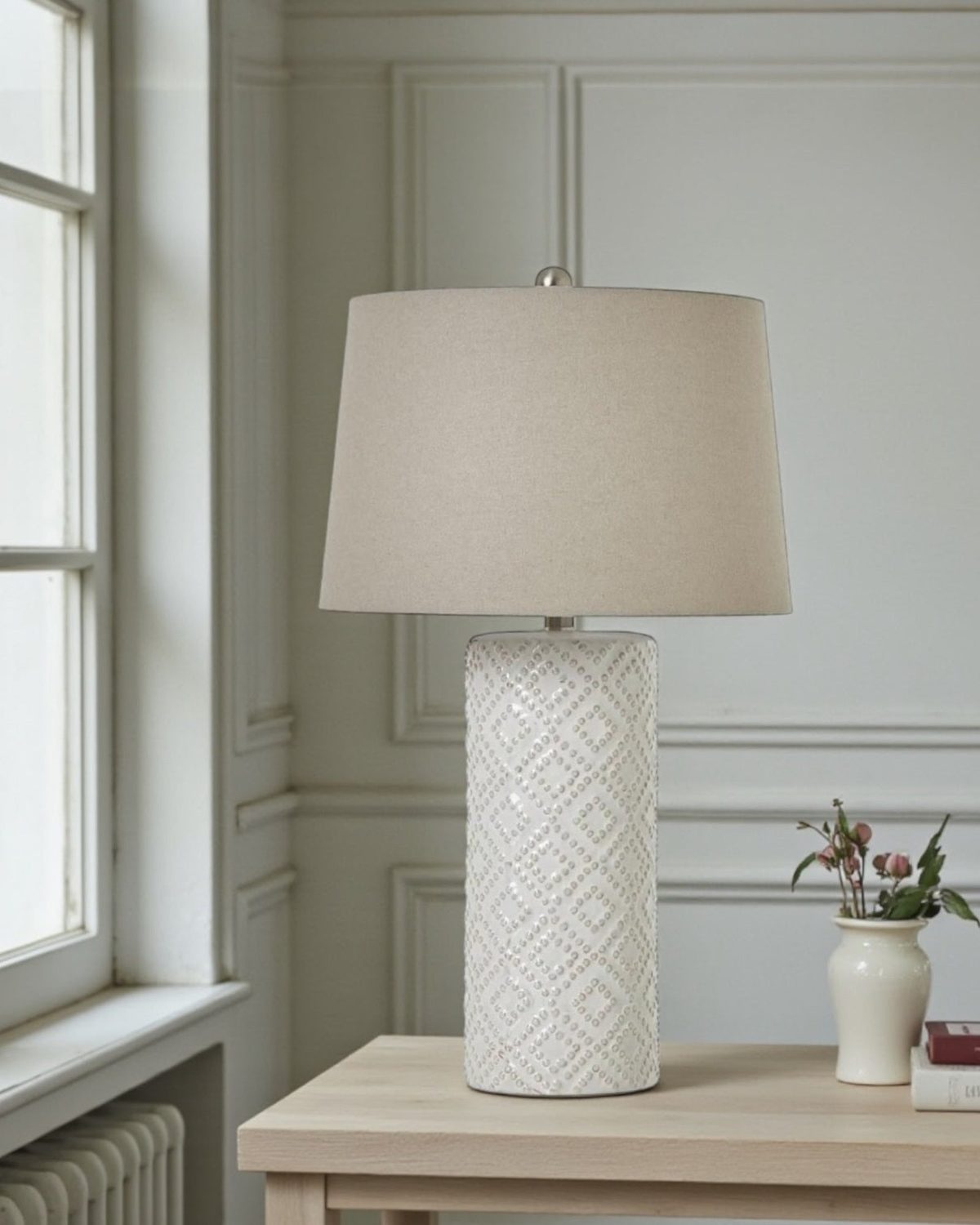Tall white beaded ceramic lamp with linen shade, decorative lighting piece by Hill Interiors for elegant interior decor.