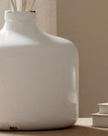 White ceramic Garda Glazed Eve Vase by Hill Interiors, showcasing a smooth, glossy finish and elegant vase shape.