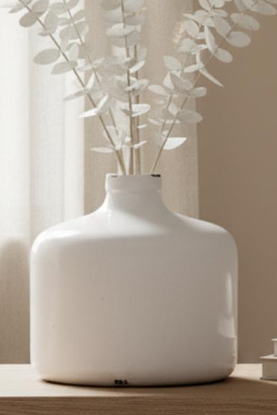 White ceramic Garda glazed Eve vase by Hill Interiors, featuring a smooth, rounded shape and glossy finish.