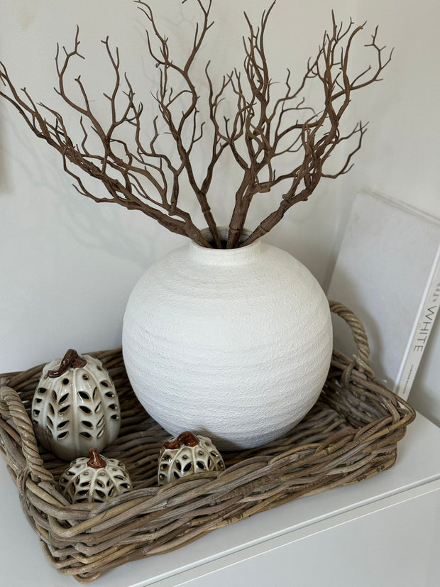 Natural Kubu rattan tray from Pacific Lifestyle Ltd, used for home decor, showcasing a round woven rattan design.