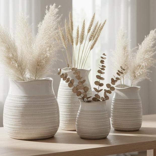 White ceramic vase with a wide neck and textured surface, designed by Hill Interiors for decorative use.