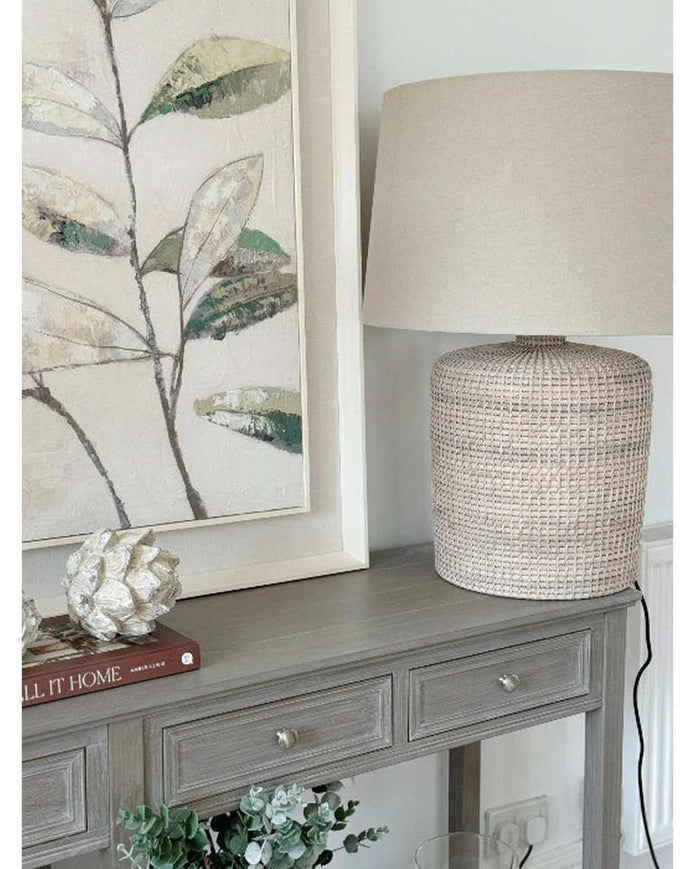 Wooden framed wall art featuring a canvas painting of vibrant green leaves by Hill Interiors.