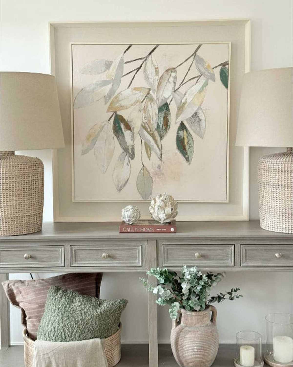 Wooden framed wall art by Hill Interiors featuring a canvas painting of vibrant green leaves for home decor.