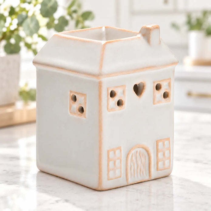 White ceramic house shaped wax melt burner by Widdop & Co in a breakfast corner design