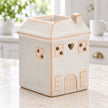 White ceramic house-shaped wax melt burner by Widdop & Co in a spring kitchen setting