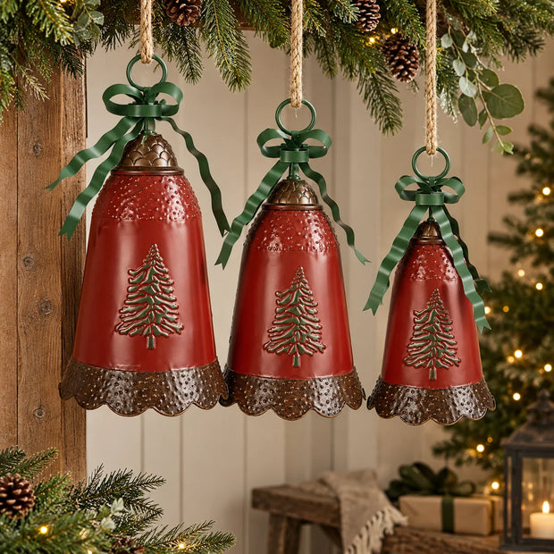 Three musical sensor metal Christmas bells with red bodies and antique bronze scalloped edges hanging at staggered heights