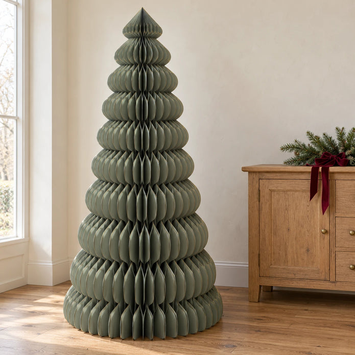 Large green Satchville paper Christmas tree standing tall, perfect for festive holiday decor and seasonal celebrations.