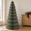 Large green Satchville paper Christmas tree standing tall, perfect for festive holiday decor and seasonal celebrations.