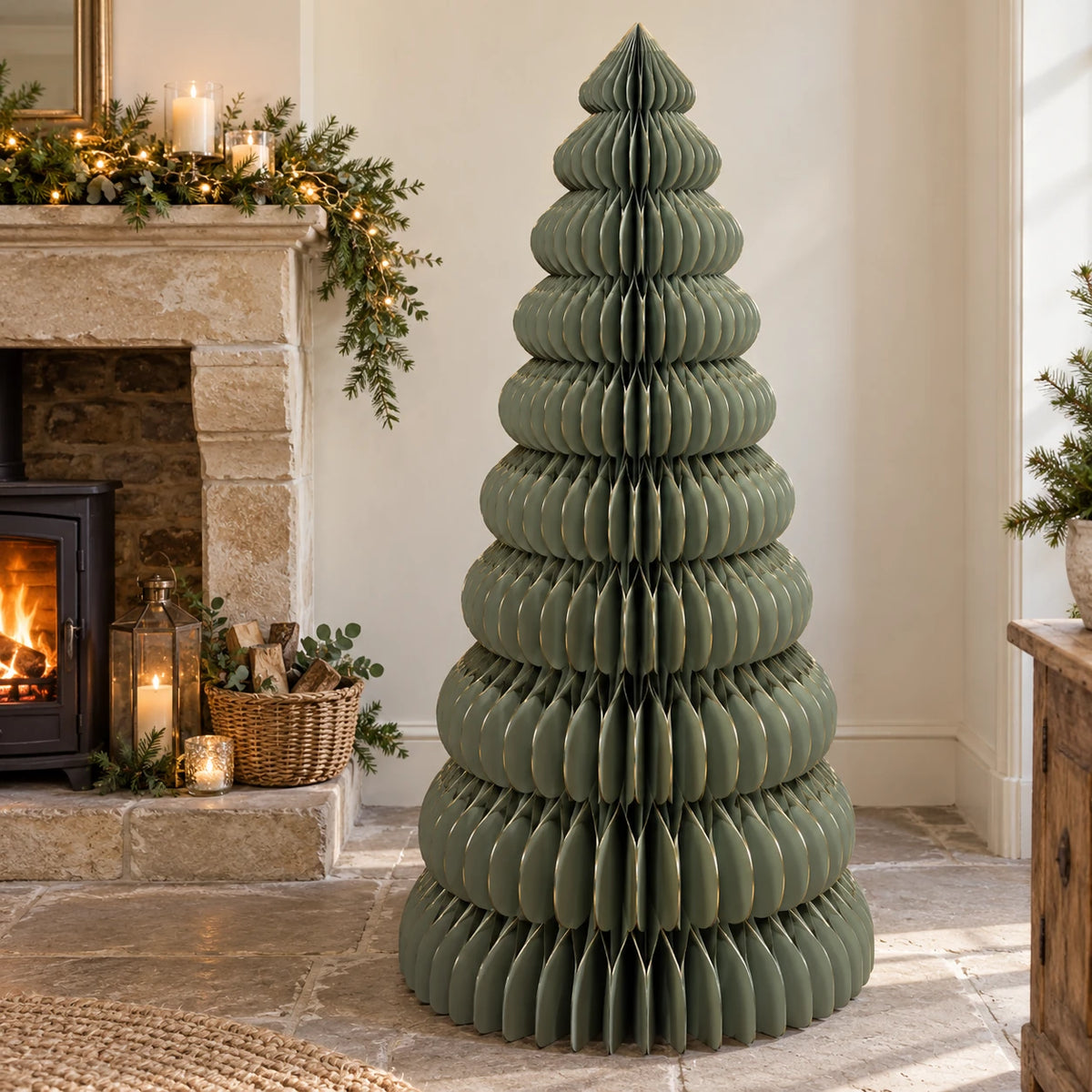 Large green paper Christmas tree by Satchville, lifesize standing holiday decoration for festive displays.