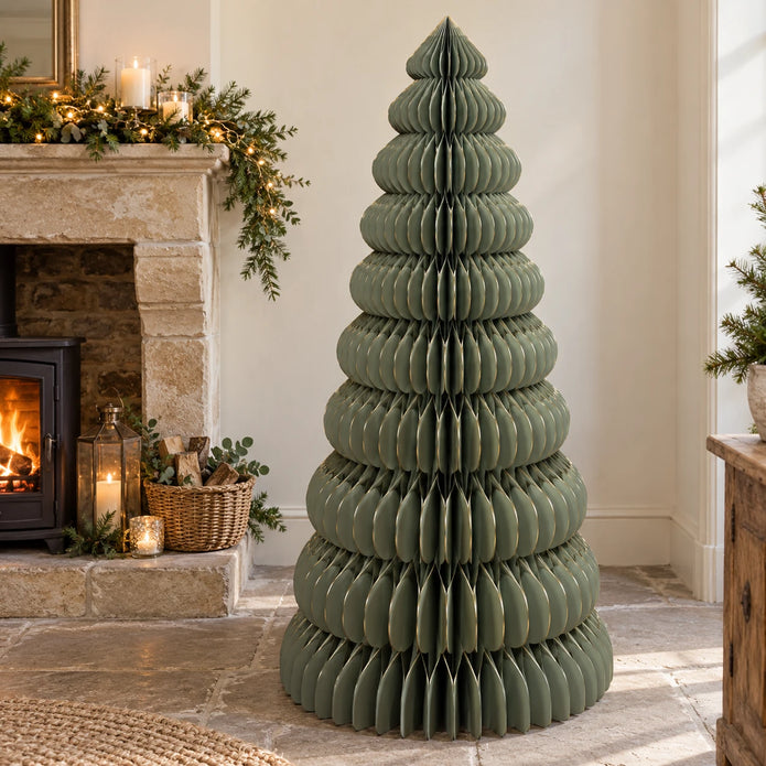 Large green paper Christmas tree by Satchville, lifesize standing holiday decoration for festive displays.