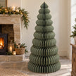 Large green paper Christmas tree by Satchville, lifesize standing holiday decoration for festive displays.