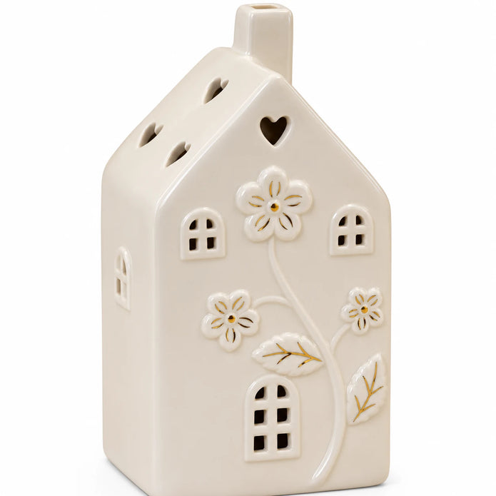 Large 17cm ivory ceramic LED house with raised flowers and gold-coloured details, detail view, LED switched off.