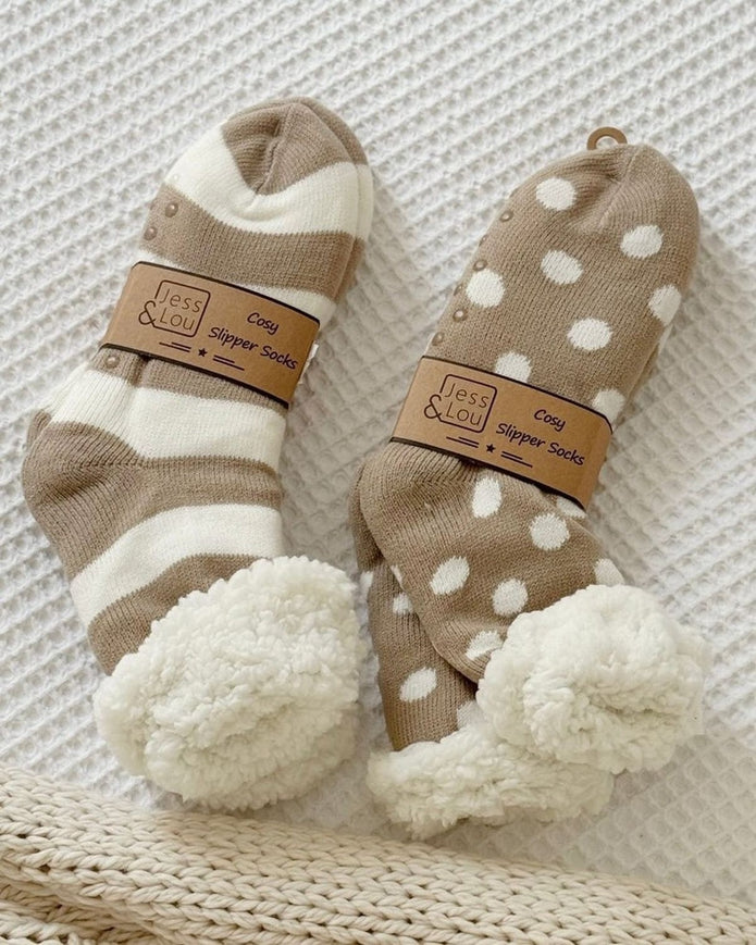 Beige polka dot cozy slipper socks from Jess & Lou, soft and warm accessories for comfortable indoor wear.