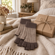 Oatmeal and cappuccino fingerless gloves styled as a cosy gift