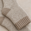 Close-up of the oatmeal and white marl sock knit