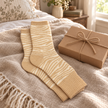 Oatmeal zebra print cosy socks styled as a warm gift