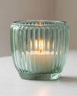 Blue glass tealight candle holders from Joe Davies, elegant home decor accents with a sleek, modern design.