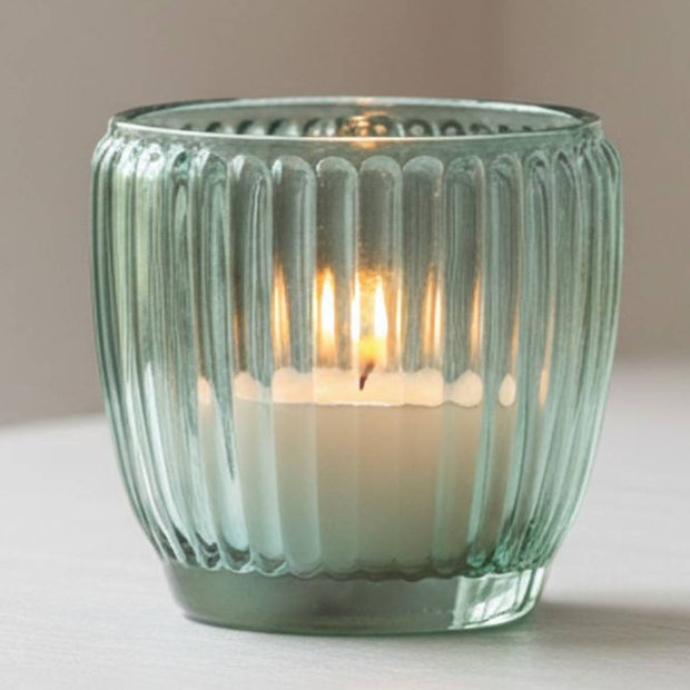 Blue glass tealight candle holders from Joe Davies, elegant home decor accents with a sleek, modern design.