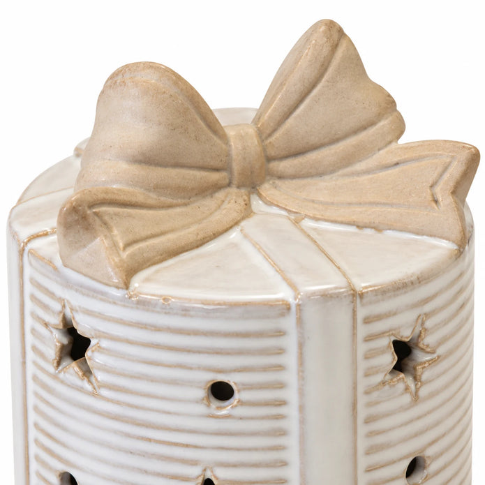 Close-up of the cream ceramic bow topper and ribbon on the LED present.