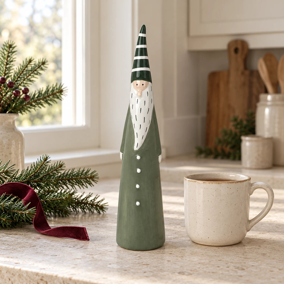 Large green ceramic Satchville Christmas gonk ornament displayed on a kitchen scale