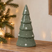 Large green ceramic Christmas tree by Satchville beside a star-shaped tree topper