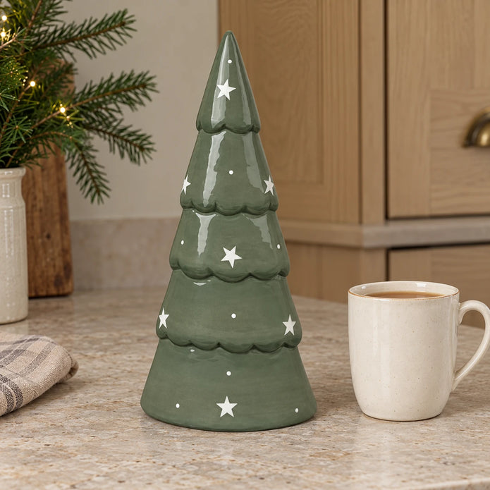 Large green Satchville ceramic Christmas tree on a kitchen scale