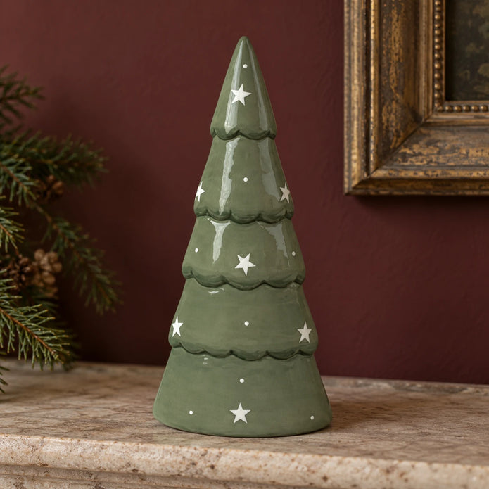Large green Satchville ceramic Christmas tree decoration displayed on a mantelpiece