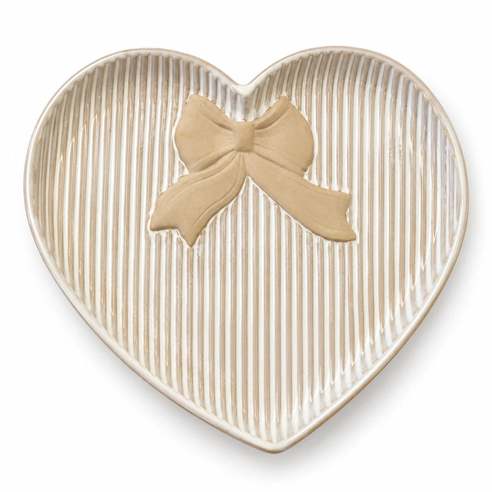 Satchville large white heart plate with bow detail on a studio background