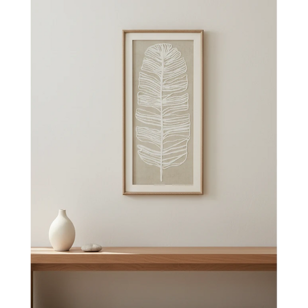 Large white feather wall art in a frame by Hill Interiors, featuring a delicate plume design for elegant home decor.