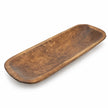 Large rustic wooden dough bowl with an elongated shallow basin and rounded ends, shown empty on white.