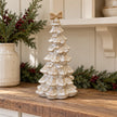 Large stone glazed ceramic bendy Christmas tree with cream bow styled in a christmas kitchen scene