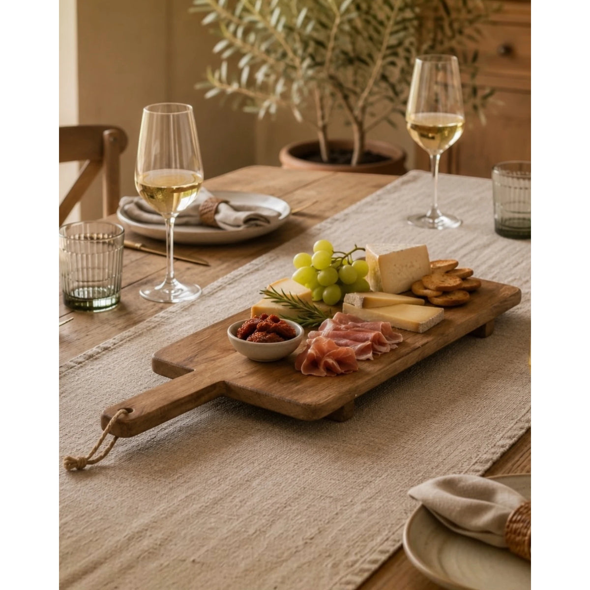 Large Wooden Footed Graze Tapas Board, wooden handled board serving food on a dining table