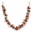 Full pinecone and red berry LED garland with jute hanging loops on white, with the lights switched off.