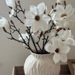 Artificial white magnolia branch stem by Hill Interiors with lifelike blossoms and green leaves