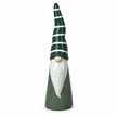 Tall green and white ceramic gonk on white studio background