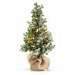 Light-up frosted Christmas tree with hessian base on a white background