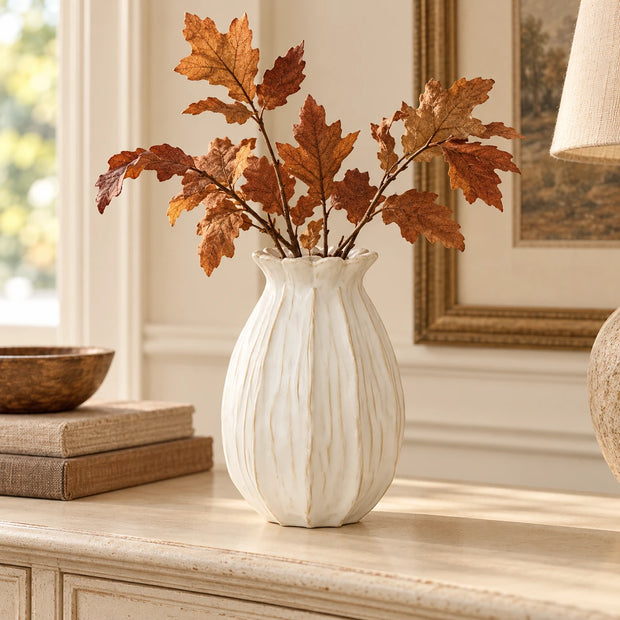 Lillian Off White Vase Medium — with a few brown autumn leaf stems of one variety on cream console