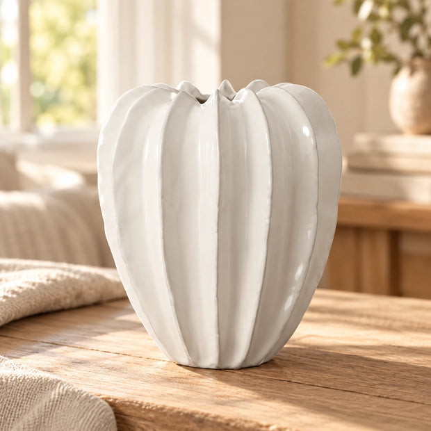 Wikholmform Lillian White Seed Head Vase with a rounded, textured ceramic surface and narrow opening, designed for floral arrangements.