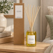 Heaven Scent LIME, BASIL & MANDARIN 100ml reed diffuser with reeds inserted beside its matching kraft gift box.