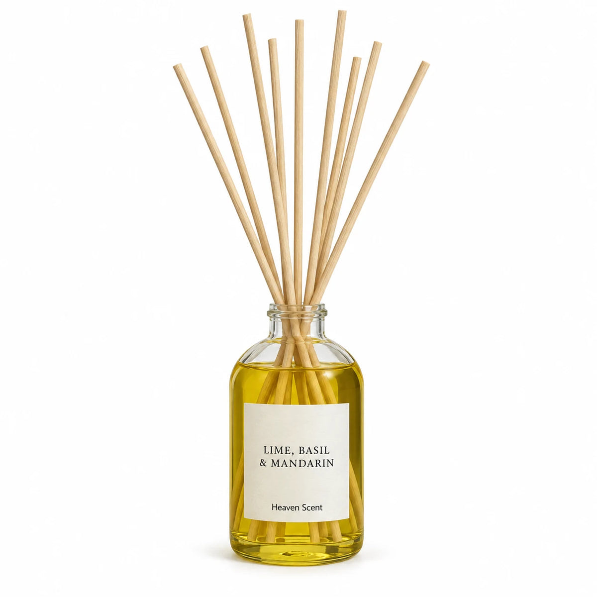 Heaven Scent LIME, BASIL & MANDARIN 100ml reed diffuser on white with natural reeds inserted.