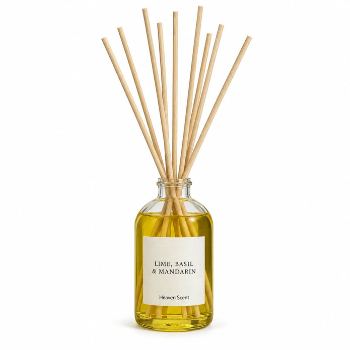 Heaven Scent LIME, BASIL & MANDARIN 100ml reed diffuser on white with natural reeds inserted.