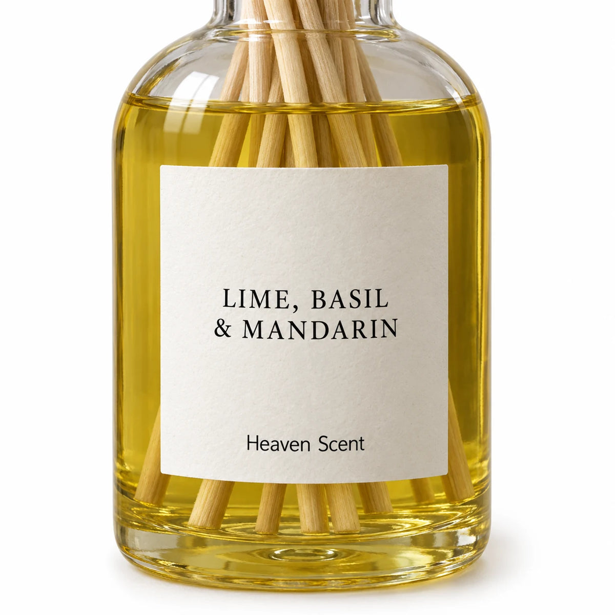 Heaven Scent LIME, BASIL & MANDARIN 100ml reed diffuser close-up of the fragrance label and glass bottle.