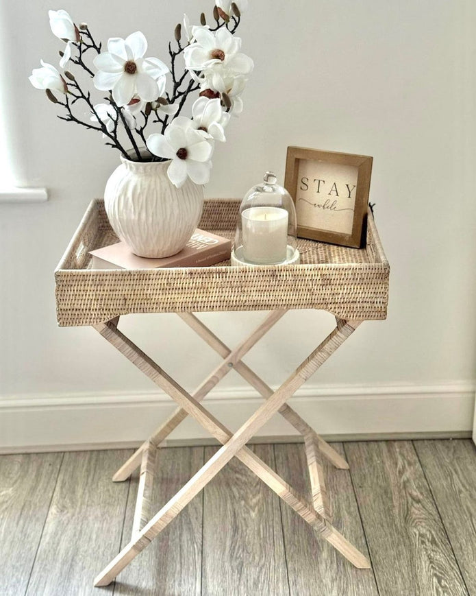 Lows rattan rectangle tripod side table with wooden legs, modern furniture piece for living room or bedroom decor.