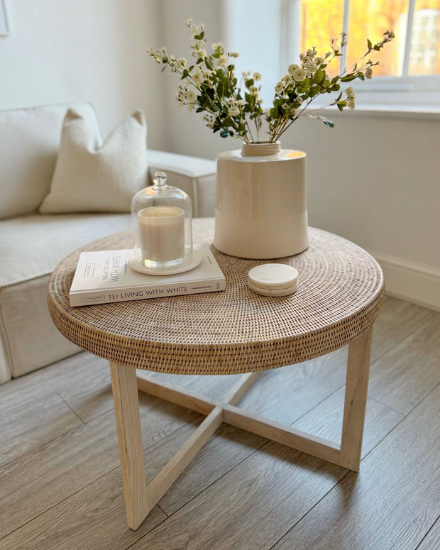 Lows Rattan Round Coffee Table with natural woven rattan surface and wooden legs, perfect for living room decor.